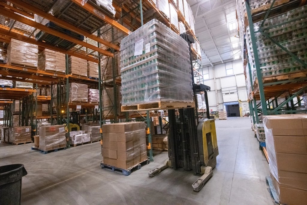 Forklift operator managing pallets